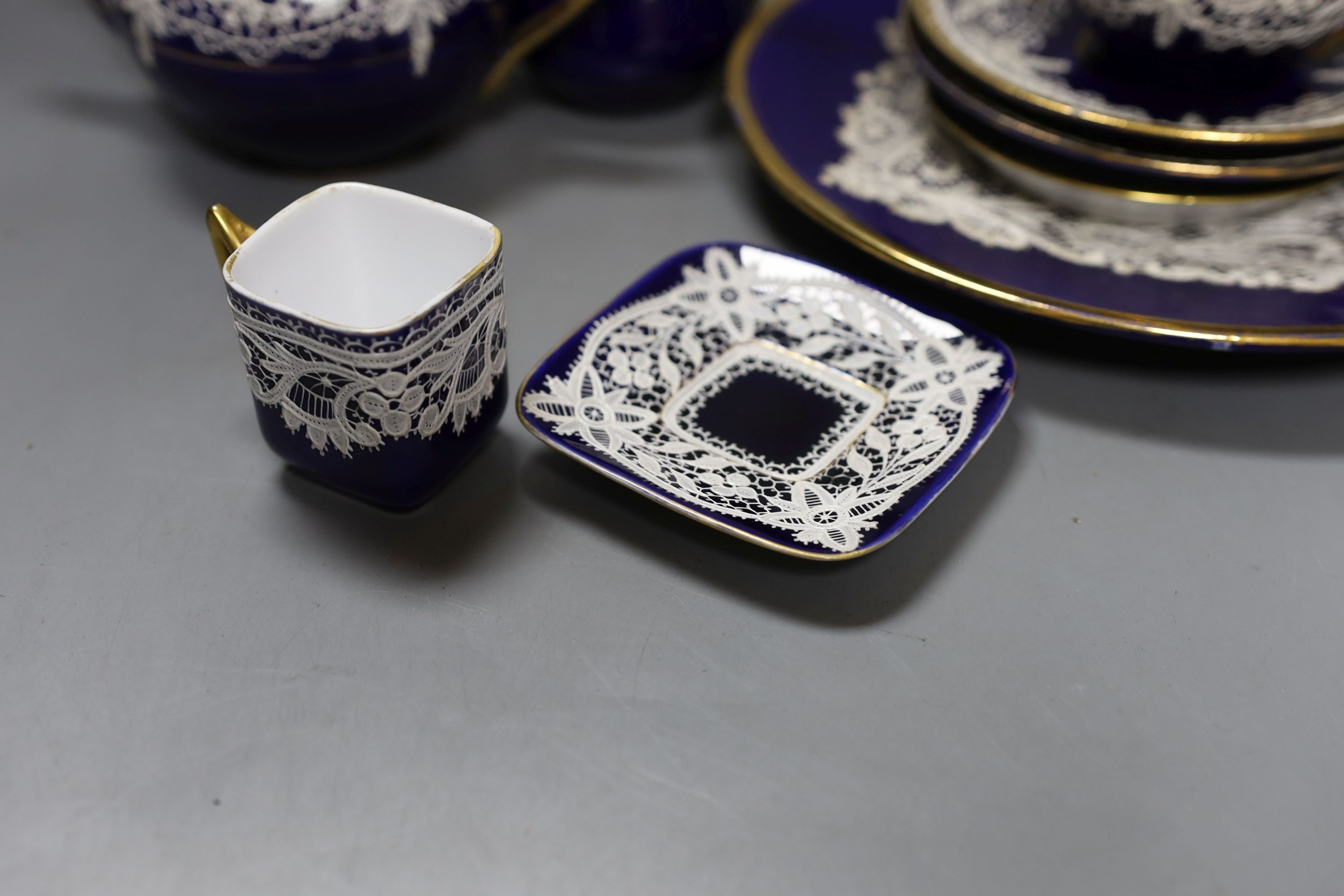 A group of Venetian Lace pattern enamelled blue glazed porcelain teaware (13)
